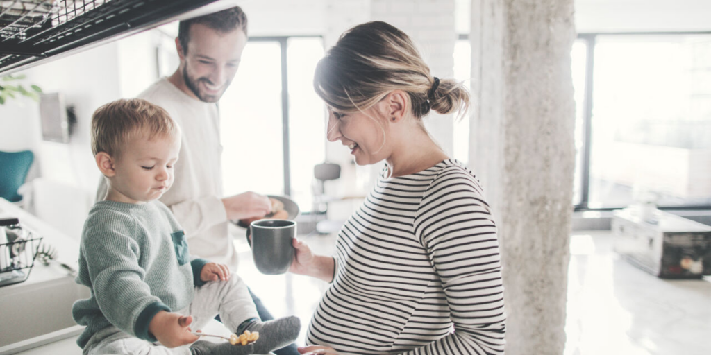 mother, father and children in the kitchen