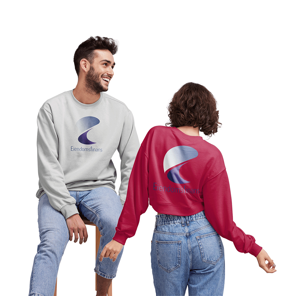 Boy and girl wearing college sweaters with the real estate finance logo on them. The boy sits on a chair and the girl stands with her back to it